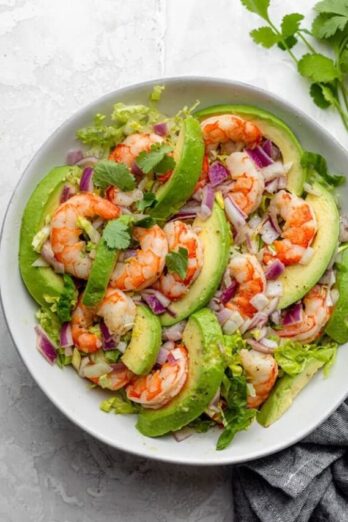 Shrimp avocado salad tossed and ready to serve