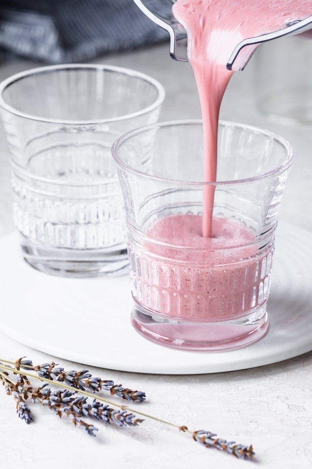 Pouring a smoothie into small cups