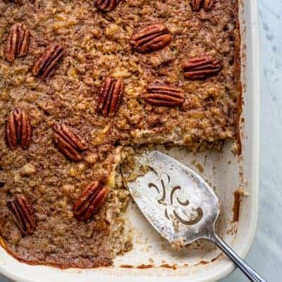 Slice cut from baked steel cut oatmeal topped with pecans