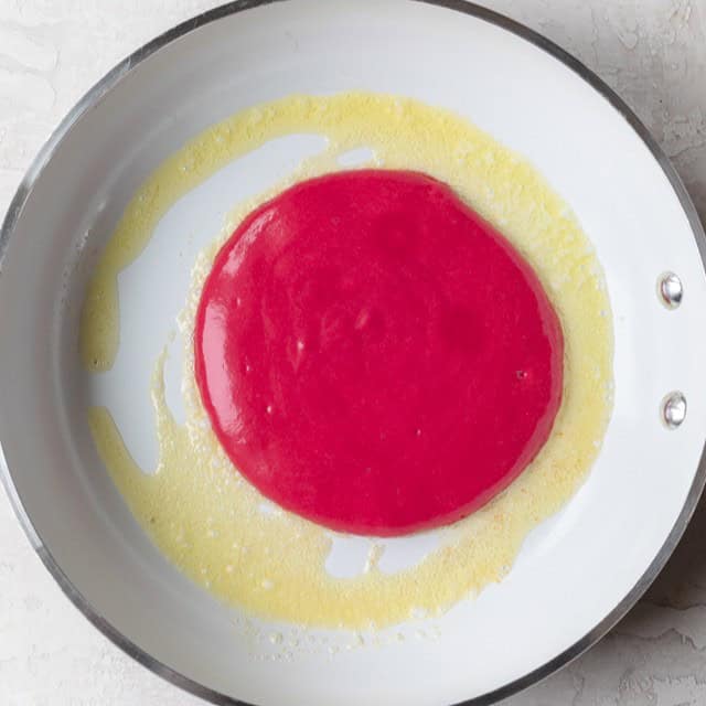 Batter on a buttered pan.