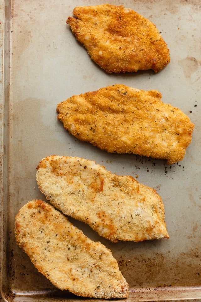 4 thinly sliced air fryer chicken after cooking - showing with and without oil