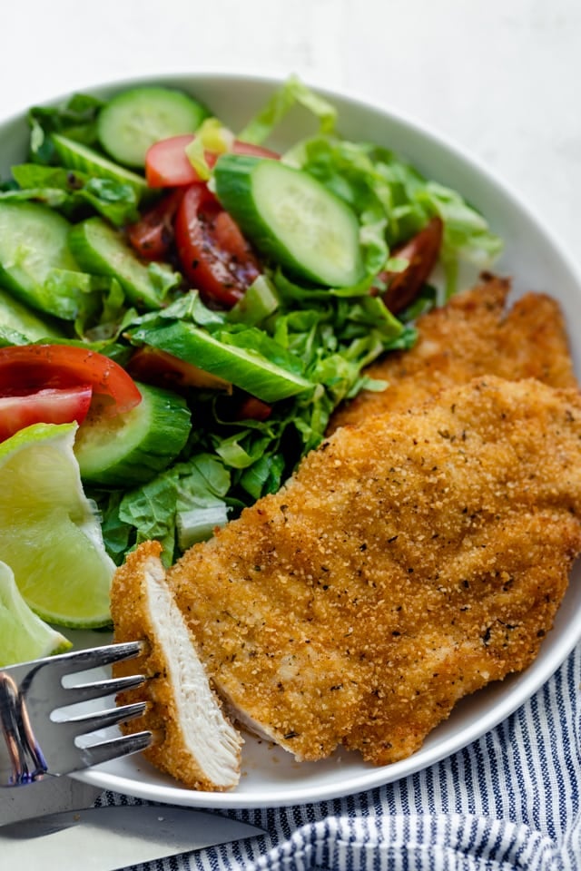 Air fryer chicken served with a green salad