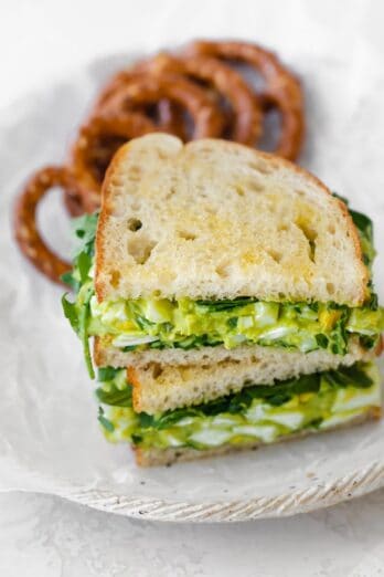 Final avocado egg salad sandwich with pretzels