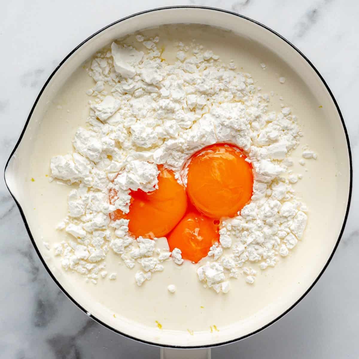 Flour, milks eggs, juice, and salt added to infused sugar.