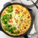 The finished vegetable frittata in a cast iron pan