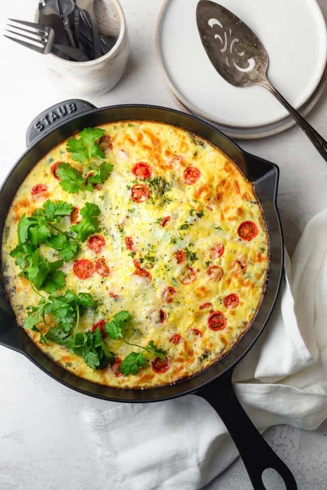 The finished vegetable frittata in a cast iron pan