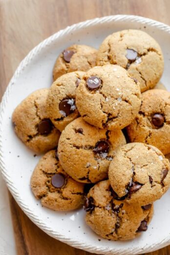 Baked flourless chocolate chip cookies on a large plate