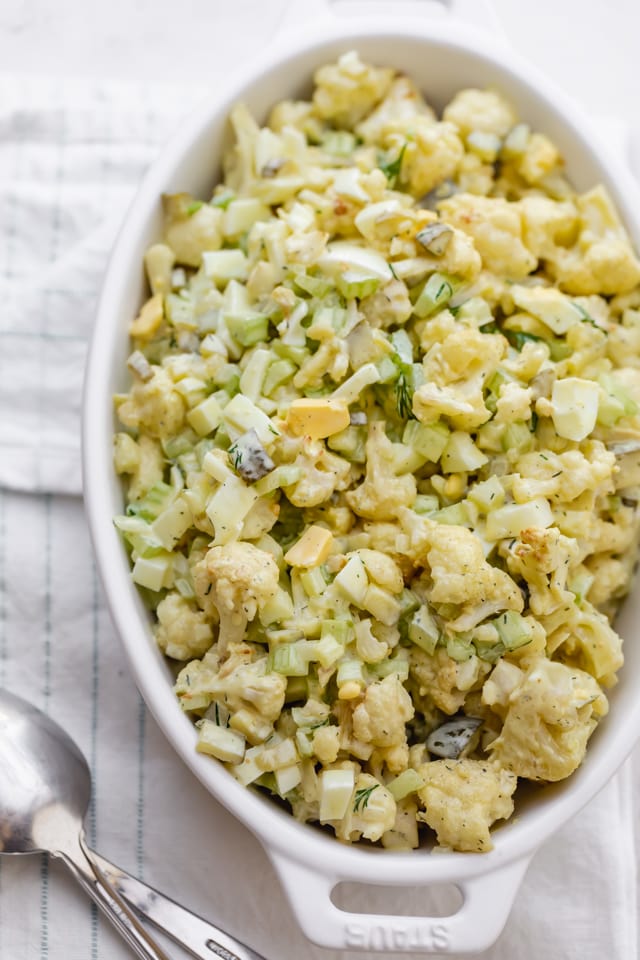 Large serving dish of the final cauliflower potato salad