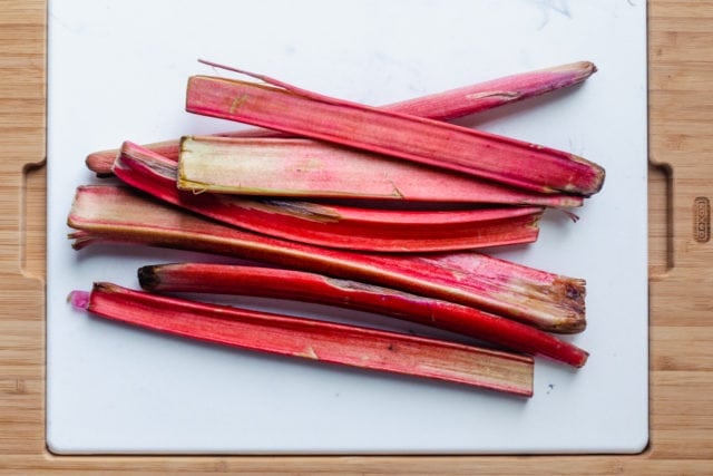 raw rhubarb on a chopping board