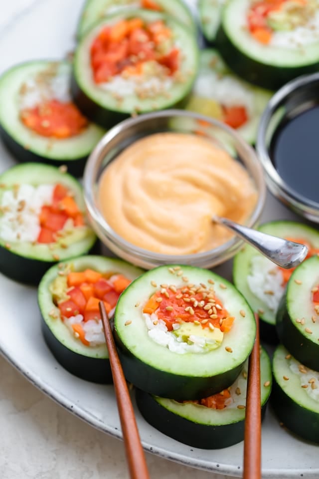 Chopsticks removing on roll from the large dish