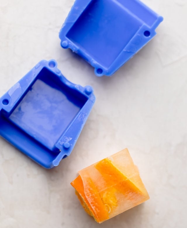 One fruit ice cube removed from mold