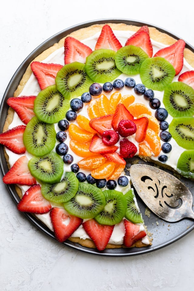 Large circular dessert pizza with slice removed