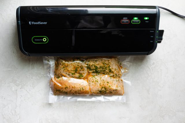 Sealing the cilantro chicken with the food saver