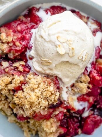 Crisp in a bowl topped with vanilla icecream,