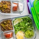 Taco salads prepped in glass meal prep containers