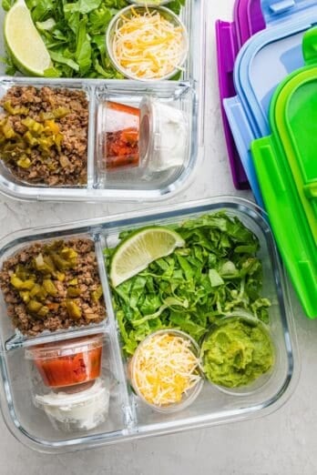 Taco salads prepped in glass meal prep containers