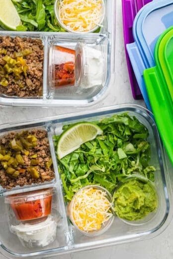 Taco salads prepped in glass meal prep containers