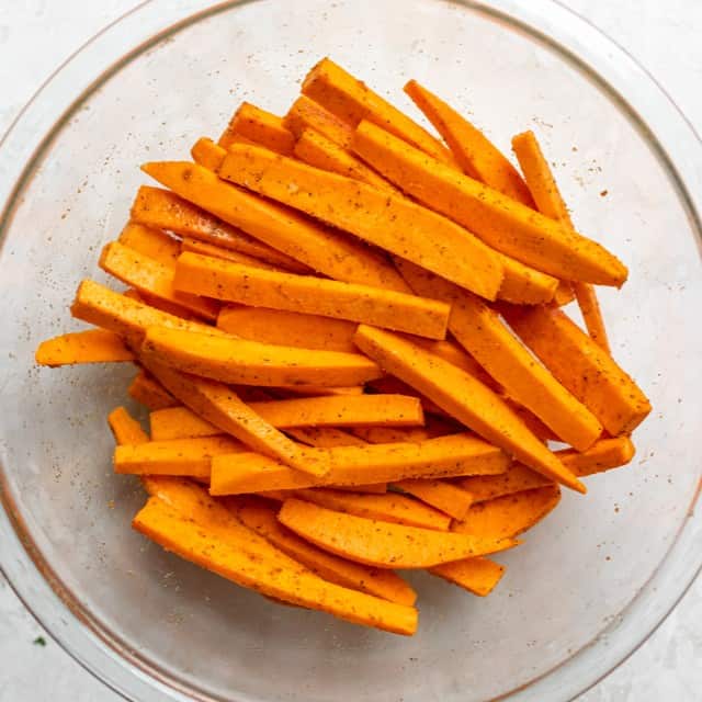 Seasoned potatoes in a bowl.