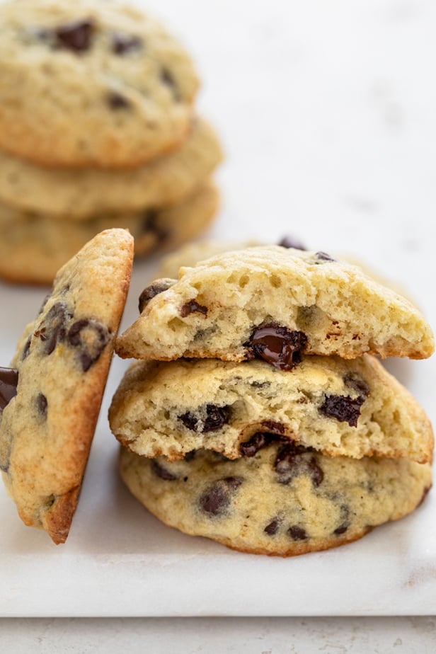 Stack of banana cookies cut in half to show soft chewy texture