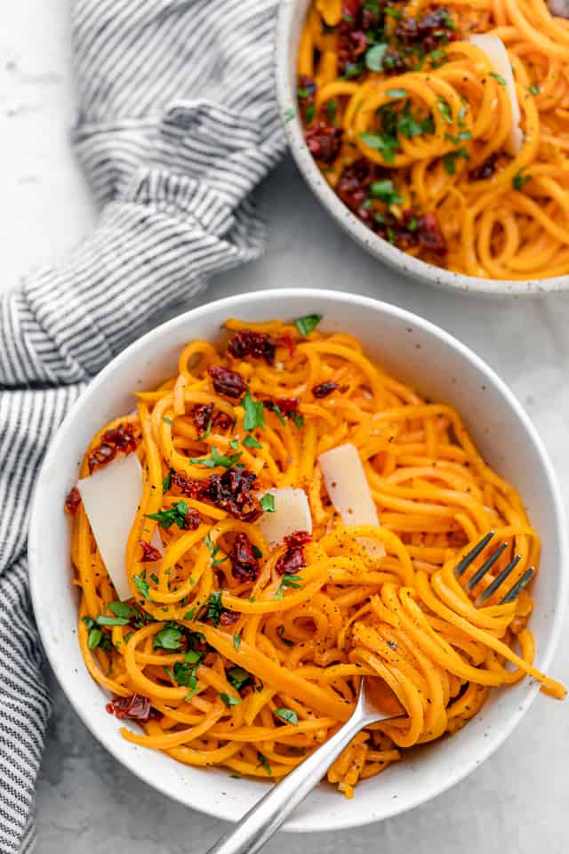 Butternut squash noodles with sun-dried tomatoes, parsley and parmesan cheese