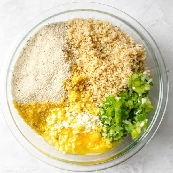 Ingredients to make cauliflower fritters in a bowl before mixing.