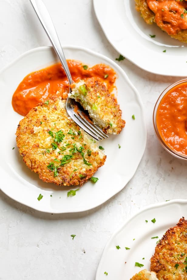 Close up of Cauliflower fritter with fork cutting into one