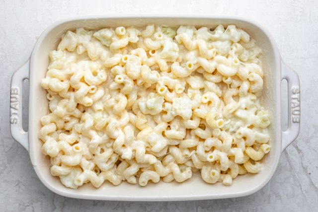 Baking dish showing the macaroni and cauliflower all mixed together