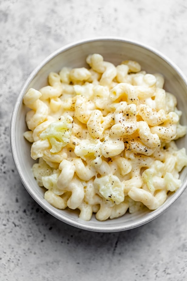 One bowl with cauliflower mac and cheese filled to the top