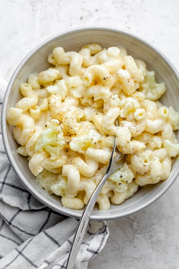 Final bowl of cauliflower mac and cheese with a fork in the bowl