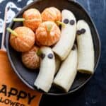 Halloween Themed Food - Final plated ghost bananas and tangerine pumpkins