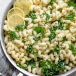 Lemon Ricotta Pasta in a large sauce pan served with kale and lemon slices