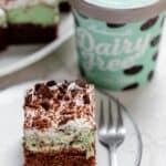 Slice of mint chocolate brownies with the dairy free mint chip ice cream in the background