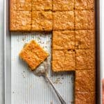Pumpkin bar recipe after being cut in baking pan and slices served