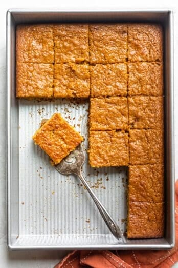 Pumpkin bar recipe after being cut in baking pan and slices served