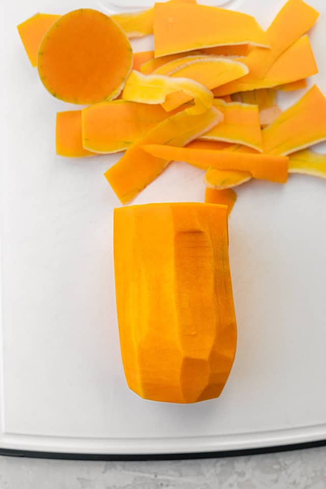 A butternut squash with its skin cut off.