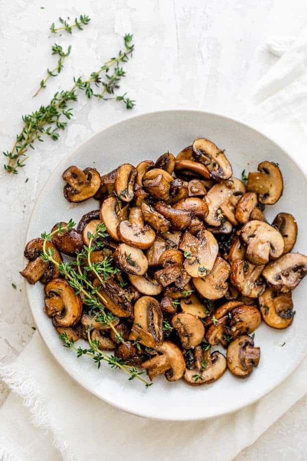 Serving plate of the sauteed mushrooms with thyme