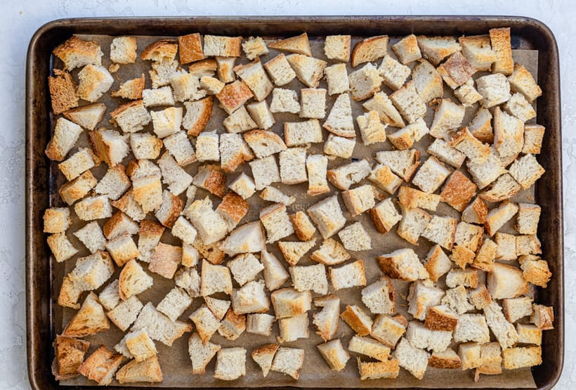 Toasted bread cubes on a baking sheet