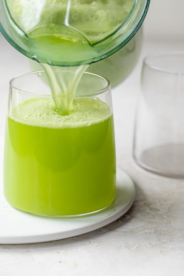 Pouring the juice into clear glass cups