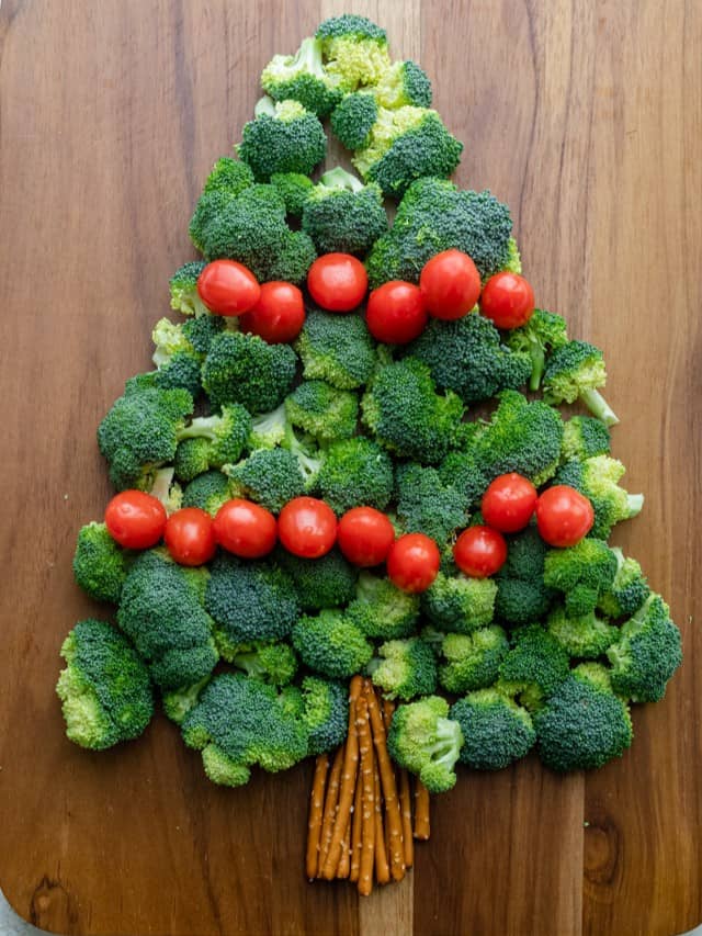 Assembling the tomatoes for the Christmas tree vegetable platter.