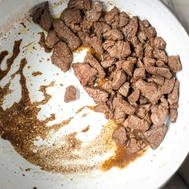 Seared beef in a pot.