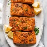 Air Fryer Salmon recipe garnished with lemon wedges and parsley