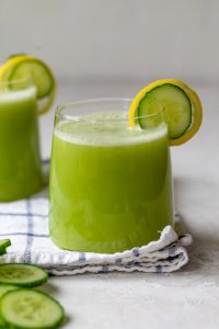 Cucumber juice in cups with cucumber slices