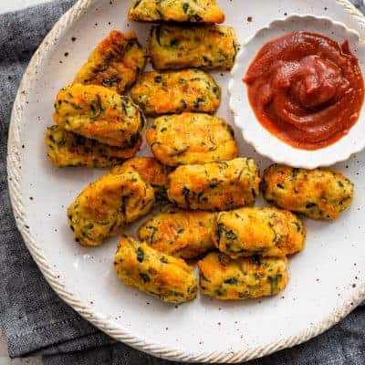 Plate of zucchini tots served with ketchup