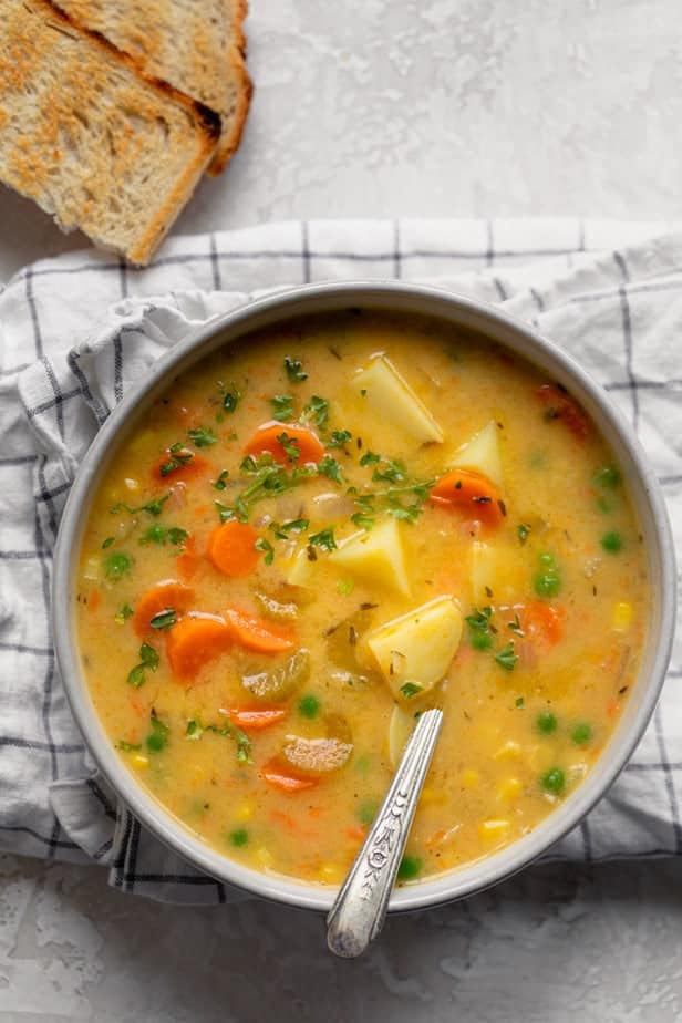 top down shot of Creamy vegetable soup with potatoes and vegetables in a bowl