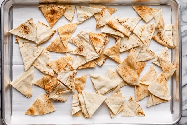 Pita cut into triangles on a baking dish