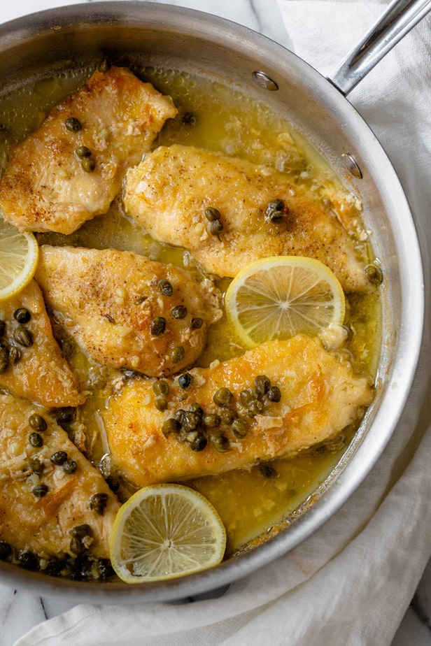 Lemon chicken piccata in the pan after cooking