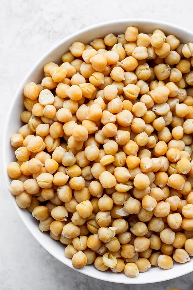 overhead shot of chickpeas in a white bowl