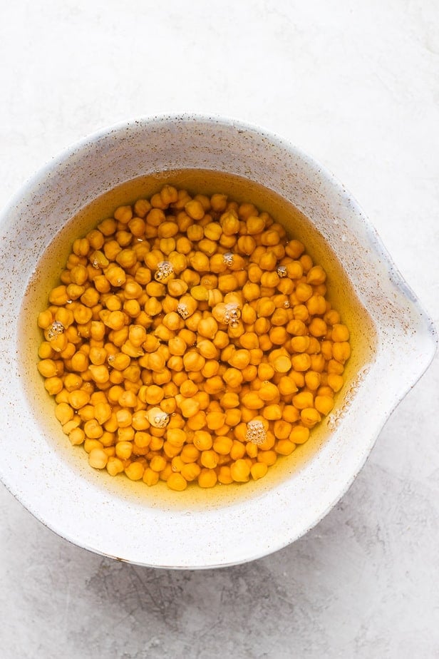 chickpeas soaking in a white bowl
