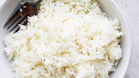 White rice with a fork in a bowl