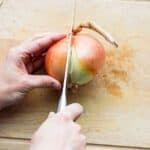 Cutting into onion
